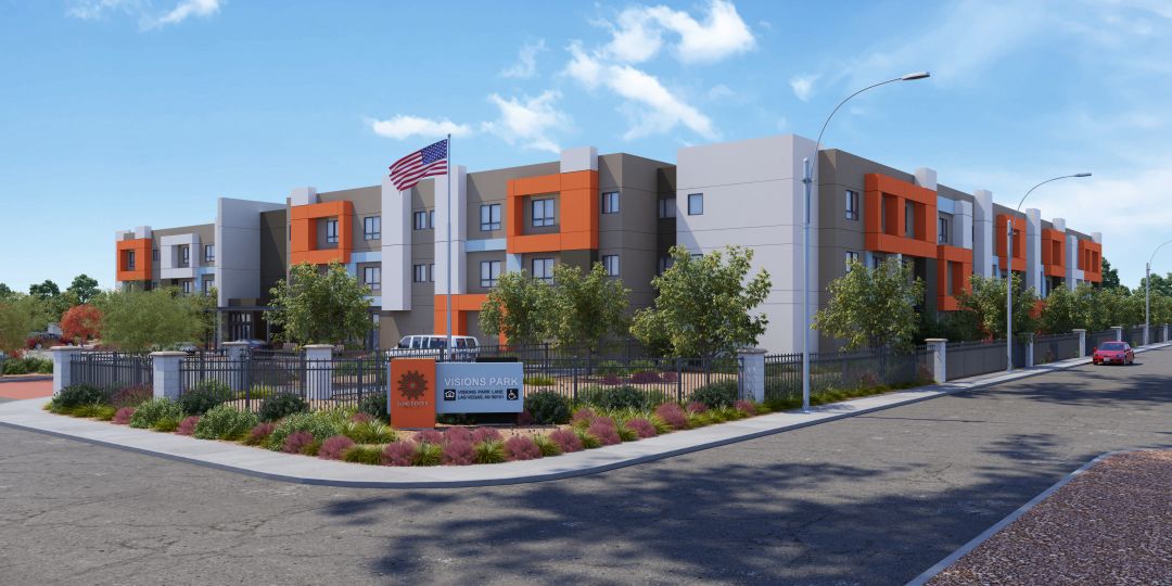 Exterior architectural rendering of Visions Park Apartments — a modern three-story building with bold orange accent panels, mature trees, landscaped entry plaza, and the Visions Park sign at the corner of the property in Las Vegas, Nevada